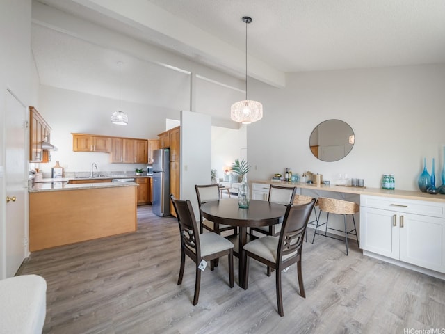 45-812 Kupohu St, Kaneohe, HI 96744 - dining room with light wood-style flooring, beamed ceiling, and high vaulted ceiling