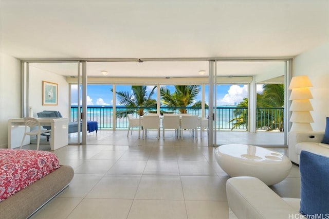 2877 Kalakaua Ave Unit 305, Honolulu, HI 96815 - living area with floor to ceiling windows, plenty of natural light, and tile patterned floors