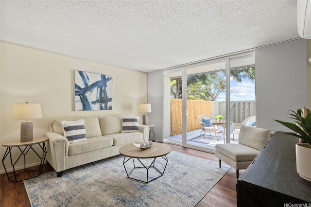 95-314 Kaloapau St Unit 122, Mililani, HI 96789 - living room featuring a textured ceiling and wood finished floors