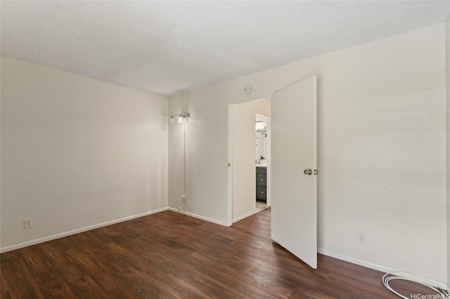 95-314 Kaloapau St Unit 122, Mililani, HI 96789 - spare room featuring dark wood-type flooring and baseboards