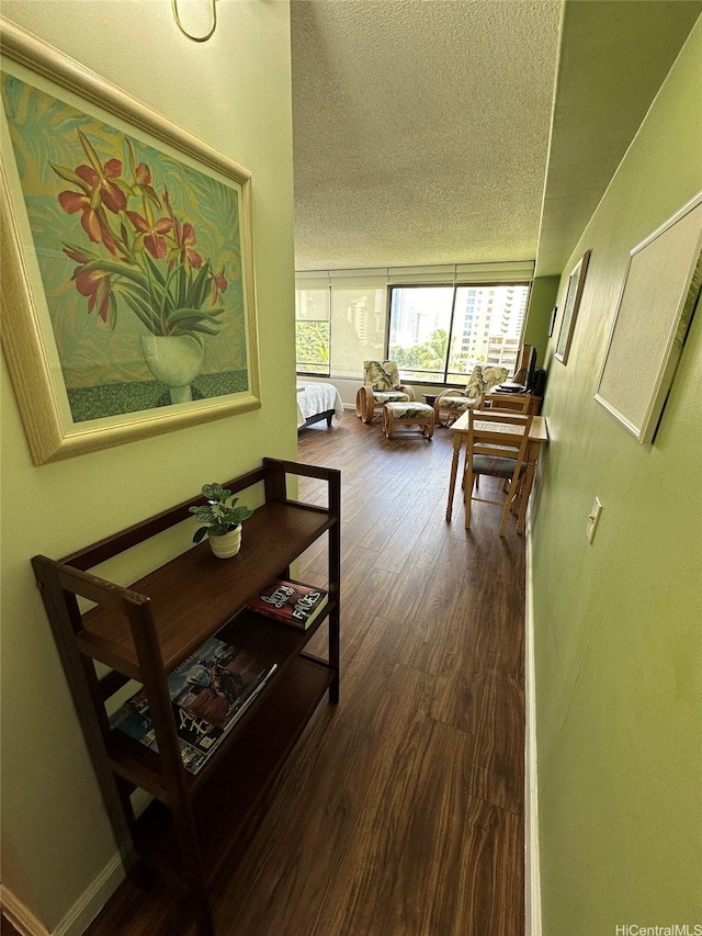 1778 Ala Moana Blvd Unit 905, Honolulu, HI 96815 - hallway featuring a textured ceiling and wood finished floors