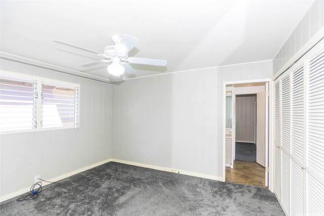 unfurnished bedroom featuring a closet, carpet, and baseboards
