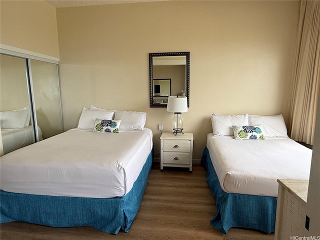 201 Ohua Ave Unit 3709-I, Honolulu, HI 96815 - bedroom featuring wood finished floors and a closet