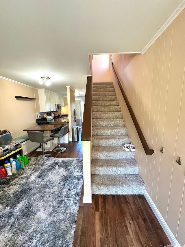 1023 Kapahulu Ave Unit 1, Honolulu, HI 96816 - staircase with wood finished floors and ornamental molding