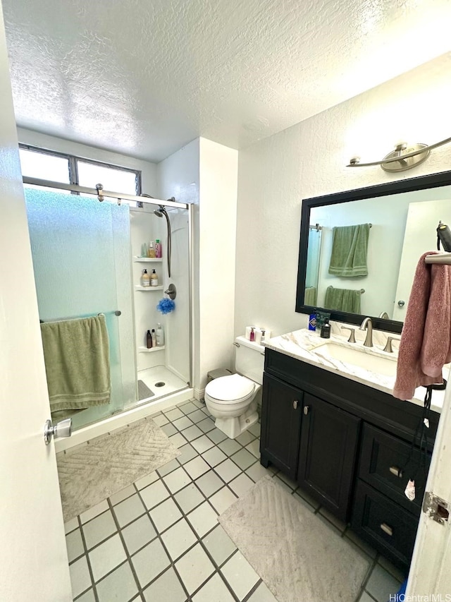 1023 Kapahulu Ave Unit 1, Honolulu, HI 96816 - bathroom with a shower stall, toilet, a textured ceiling, and vanity