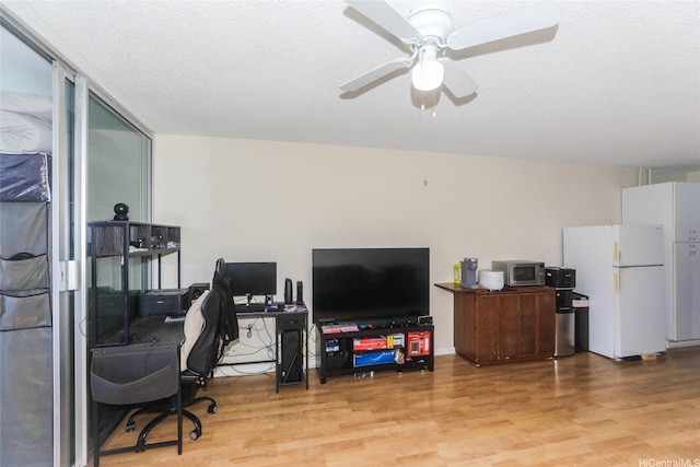 1718 Anapuni St Unit 205, Honolulu, HI 96822 - office area with wood finished floors, a ceiling fan, and a textured ceiling