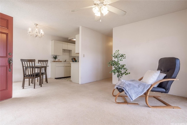 94-1064 Paawalu St Unit N1, Waipahu, HI 96797 - living area with light carpet, a chandelier, and a ceiling fan