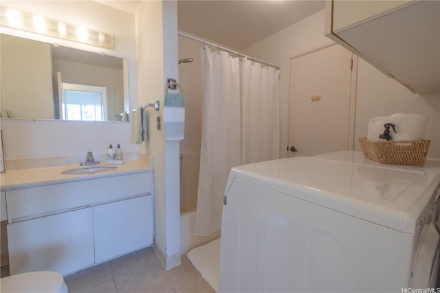 94-1064 Paawalu St Unit N1, Waipahu, HI 96797 - bathroom featuring washer / dryer, tile patterned flooring, vanity, and toilet