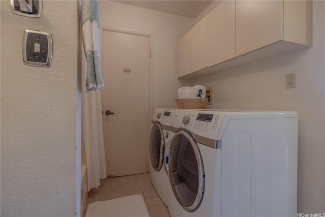 94-1064 Paawalu St Unit N1, Waipahu, HI 96797 - laundry area featuring washing machine and clothes dryer, cabinet space, and light tile patterned flooring