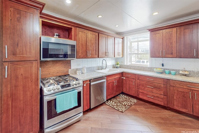 201 N Circle Mauka St, Wahiawa, HI 96786 - kitchen featuring appliances with stainless steel finishes, a sink, light wood-style flooring, ornamental molding, and light stone countertops