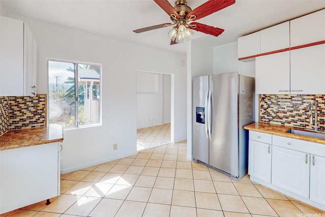 201 N Circle Mauka St, Wahiawa, HI 96786 - kitchen featuring stainless steel fridge with ice dispenser, a sink, white cabinetry, and tasteful backsplash