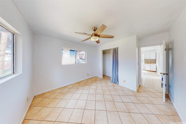201 N Circle Mauka St, Wahiawa, HI 96786 - unfurnished bedroom featuring a closet, ceiling fan, light tile patterned floors, and baseboards