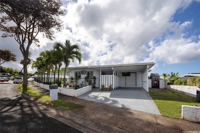 2283 Anapanapa St, Pearl City, HI 96782 - manufactured / mobile home featuring concrete driveway, an attached carport, and a gate