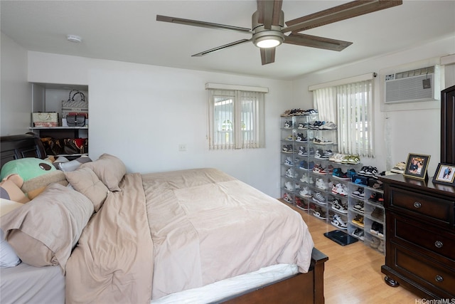 2283 Anapanapa St, Pearl City, HI 96782 - bedroom with multiple windows, light wood-type flooring, a wall mounted AC, and a ceiling fan