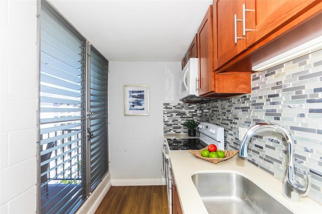1541 Dominis St Unit 1601, Honolulu, HI 96822 - kitchen featuring electric range, a sink, light countertops, dark wood-style flooring, and brown cabinetry
