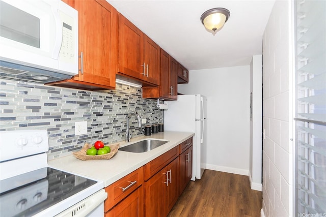 1541 Dominis St Unit 1601, Honolulu, HI 96822 - kitchen featuring white appliances, a sink, light countertops, dark wood-type flooring, and decorative backsplash