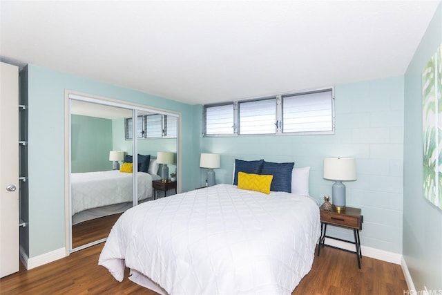 1541 Dominis St Unit 1601, Honolulu, HI 96822 - bedroom with baseboards, wood finished floors, and a closet