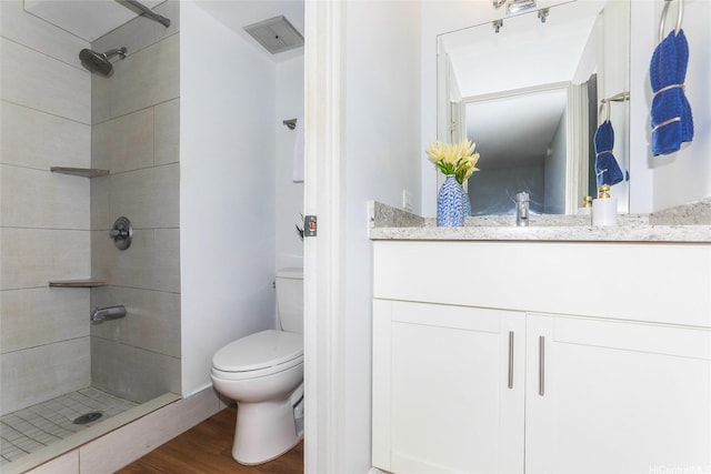 1541 Dominis St Unit 1601, Honolulu, HI 96822 - full bath with wood finished floors, toilet, tiled shower, and vanity