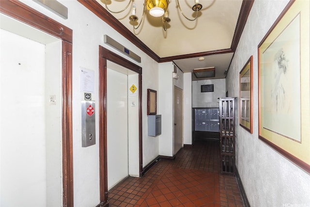 1541 Dominis St Unit 1601, Honolulu, HI 96822 - hall featuring elevator, ornamental molding, tile patterned floors, and a chandelier