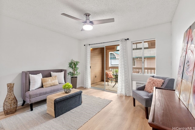94-870 Lumiauau St Unit T203, Waipahu, HI 96797 - sitting room featuring ceiling fan, light wood-type flooring, and a textured ceiling