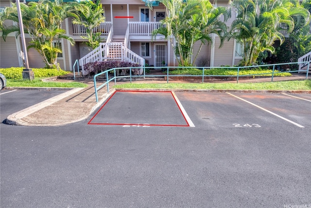 94-870 Lumiauau St Unit T203, Waipahu, HI 96797 - uncovered parking lot featuring fence and stairway