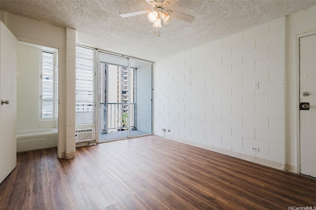 2509 Ala Wai Blvd Unit 804, Honolulu, HI 96815 - empty room with wood finished floors, a textured ceiling, ceiling fan, concrete block wall, and floor to ceiling windows
