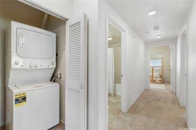 458 Manawai St Unit 512, Kapolei, HI 96707 - laundry area featuring stacked washing machine and dryer and light colored carpet