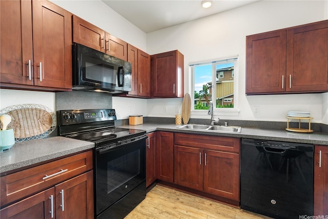 458 Manawai St Unit 512, Kapolei, HI 96707 - kitchen featuring black appliances, dark countertops, and light wood-type flooring