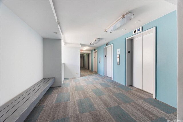 430 Keoniana St Unit 1007, Honolulu, HI 96815 - corridor featuring elevator and carpet floors