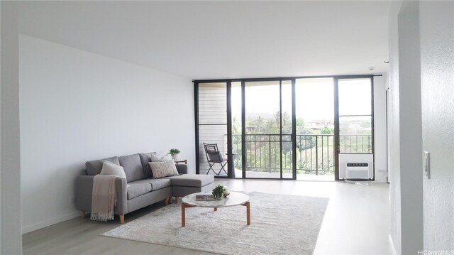 98-501 Koauka Loop Unit A1006, Aiea, HI 96701 - living room featuring a wall of windows and wood finished floors