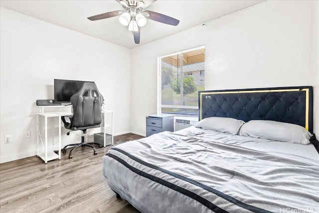 92-1210 Palahia St Unit V203, Kapolei, HI 96707 - bedroom with wood finished floors, baseboards, a ceiling fan, cooling unit, and a desk