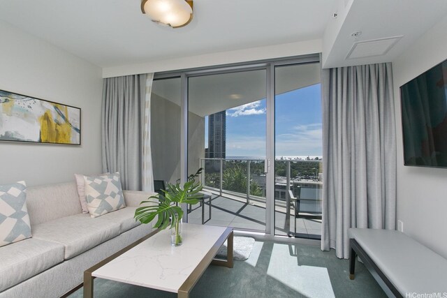 2139 Kuhio Ave Unit D1008, Honolulu, HI 96815 - living area with floor to ceiling windows and carpet