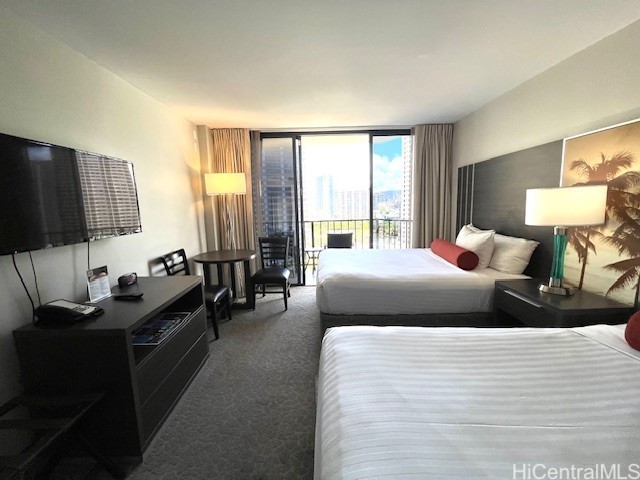 1850 Ala Moana Blvd Unit 1007, Honolulu, HI 96815 - carpeted bedroom featuring a wall of windows and access to outside