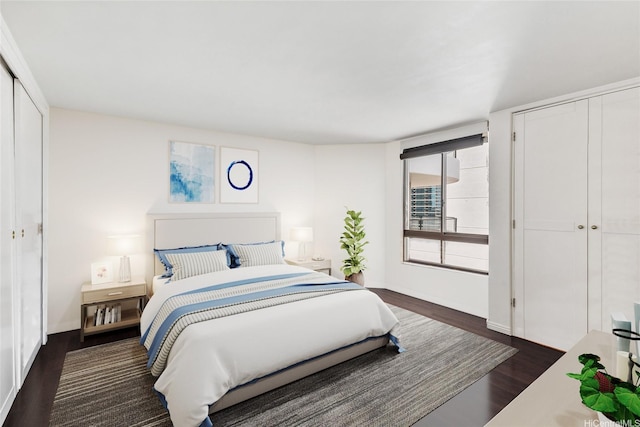 1910 Ala Moana Blvd Unit 19C, Honolulu, HI 96815 - bedroom featuring dark wood-style floors and baseboards