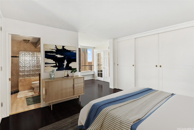 1910 Ala Moana Blvd Unit 19C, Honolulu, HI 96815 - bedroom with dark wood-type flooring, a closet, and ensuite bath