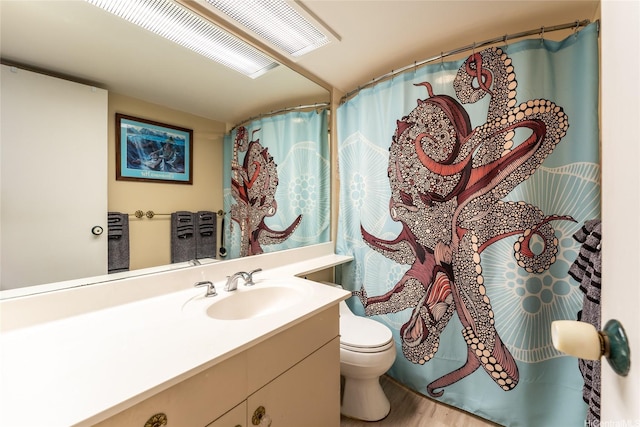 1860 Ala Moana Blvd Unit 1206, Honolulu, HI 96815 - full bath with toilet, vanity, wood finished floors, and a shower with curtain