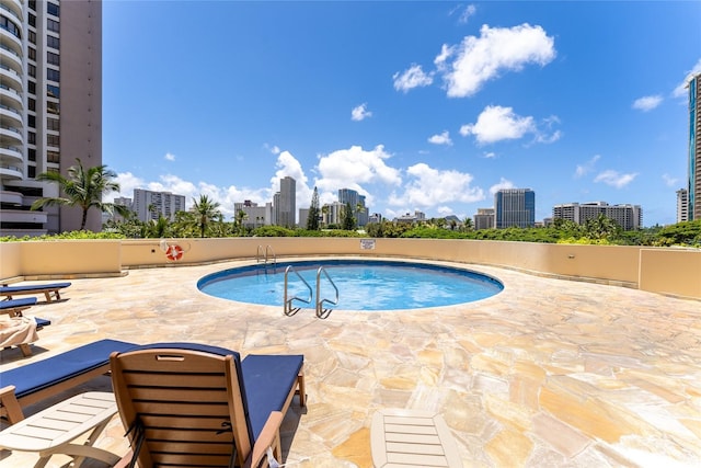 1860 Ala Moana Blvd Unit 1206, Honolulu, HI 96815 - community pool featuring a view of skyline and a patio