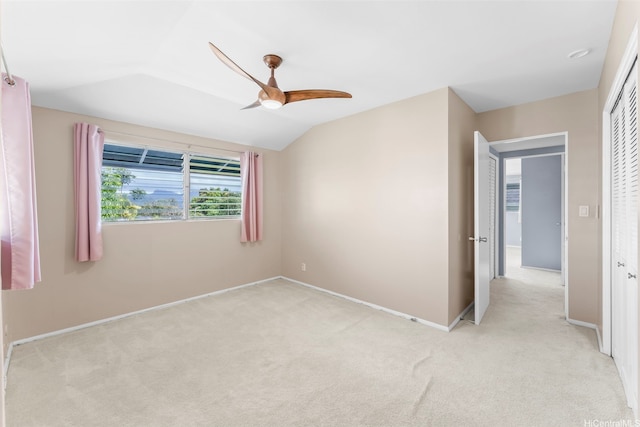 47-612 Hui Kelu St, Kaneohe, HI 96744 - unfurnished bedroom featuring light colored carpet, a closet, vaulted ceiling, and a ceiling fan