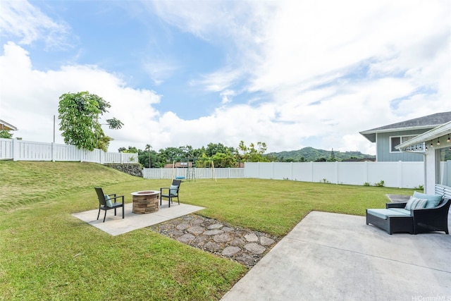 47-612 Hui Kelu St, Kaneohe, HI 96744 - fenced backyard featuring an outdoor fire pit and a patio