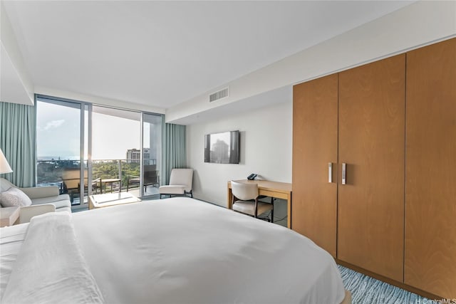 383 Kalaimoku St Unit 1112, Honolulu, HI 96815 - bedroom featuring a wall of windows and access to exterior