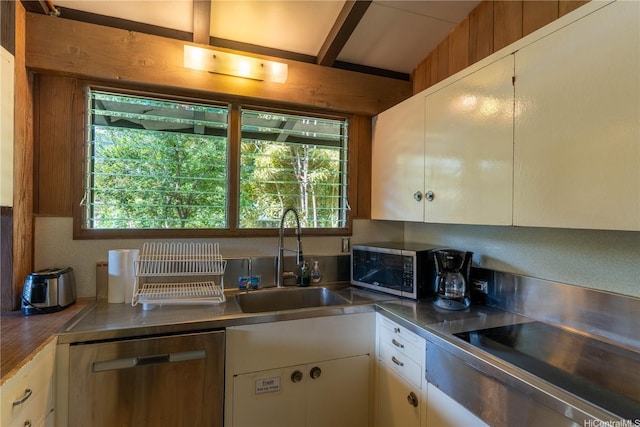 41-1025 Nenue St, Waimanalo, HI 96795 - kitchen with appliances with stainless steel finishes, stainless steel counters, white cabinetry, and beam ceiling