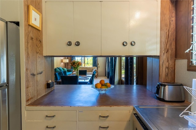 41-1025 Nenue St, Waimanalo, HI 96795 - kitchen with freestanding refrigerator, stainless steel countertops, and healthy amount of natural light