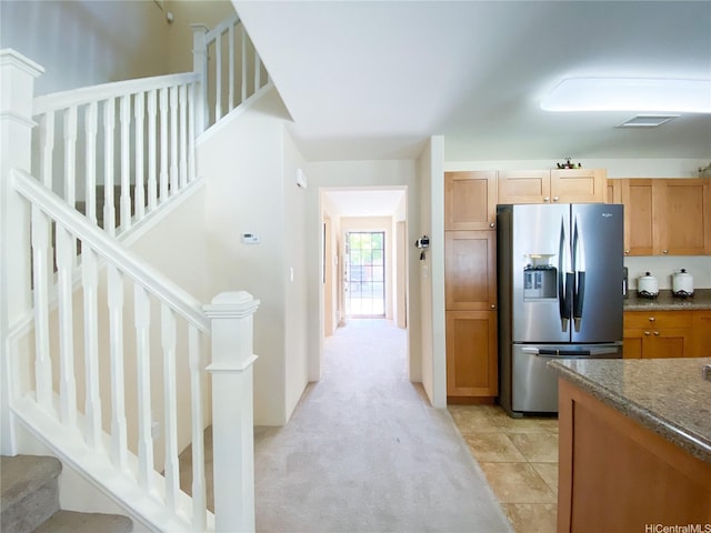 91-1775 Waiaama St, Ewa Beach, HI 96706 - kitchen featuring stainless steel refrigerator with ice dispenser, light colored carpet, and dark stone counters