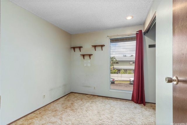 94-046 Puanane Pl, Mililani, HI 96789 - empty room with carpet floors, a textured ceiling, and baseboards