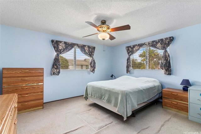 94-046 Puanane Pl, Mililani, HI 96789 - carpeted bedroom with multiple windows, a textured ceiling, and a ceiling fan