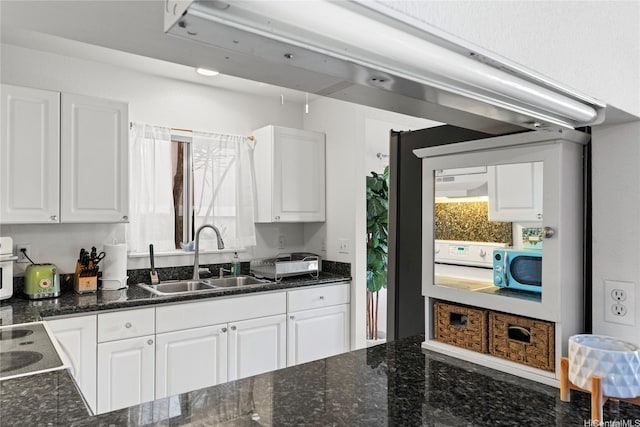 2290 Akepa St, Pearl City, HI 96782 - kitchen featuring a sink, white cabinets, plenty of natural light, and dark stone countertops