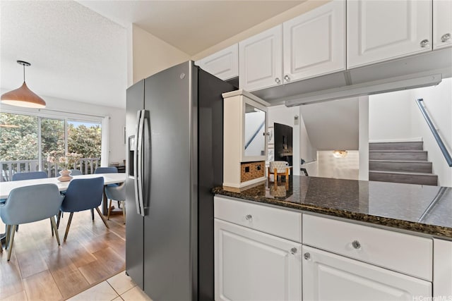 2290 Akepa St, Pearl City, HI 96782 - kitchen featuring stainless steel refrigerator with ice dispenser, white cabinets, and dark stone counters