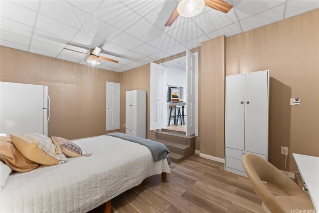 2290 Akepa St, Pearl City, HI 96782 - bedroom featuring wood finished floors, ceiling fan, a drop ceiling, baseboards, and freestanding refrigerator