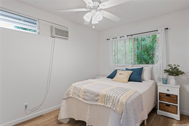 2290 Akepa St, Pearl City, HI 96782 - bedroom featuring multiple windows, wood finished floors, and baseboards