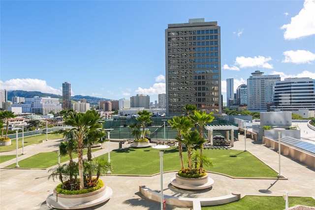 1296 Kapiolani Blvd Unit 3805, Honolulu, HI 96814 - view of home's community featuring a view of skyline, a pergola, and a lawn